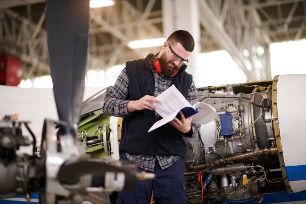istock Aircraft mechanic in the hangar 936801722