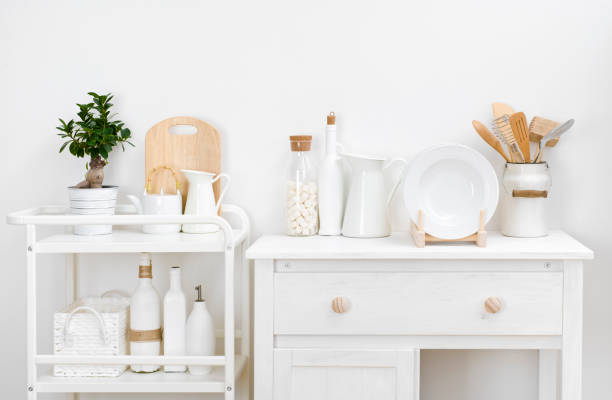 istock Various kitchen utensils and dishware with elegant vintage white furniture 936805372
