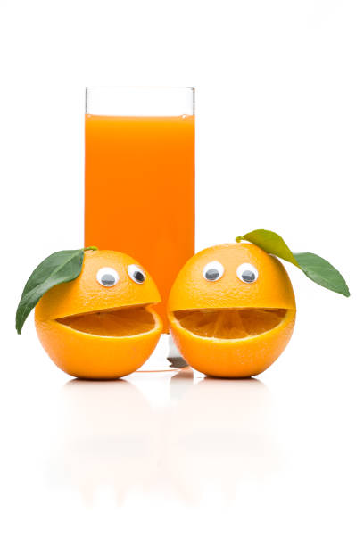 istock Two laughing oranges with orange juice isolated on white background 936808778