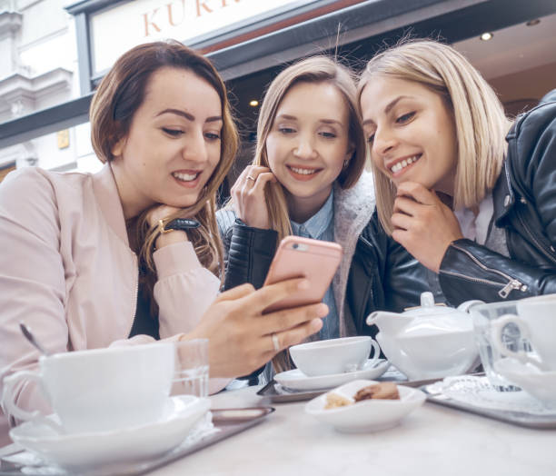 istock Girl friends with smartphone 936815726