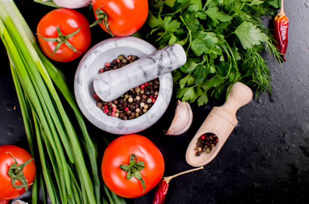 istock cherry tomatoes on a branch, oil,  parsley and spice 936816226