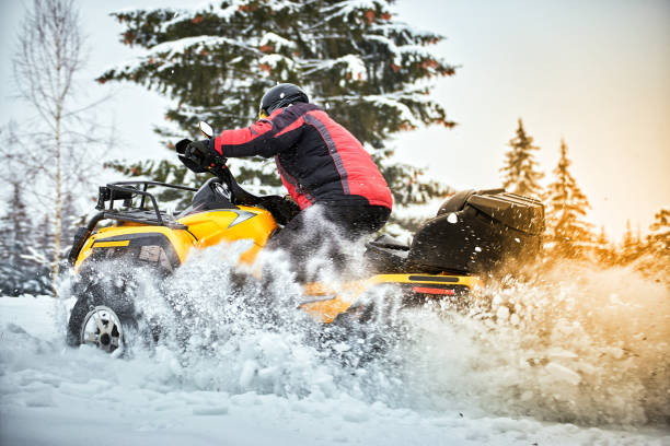 istock Winter race on an ATV on snow in the forest. 936817030
