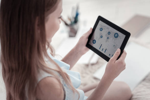 istock Girl searching on her tablet 936817370
