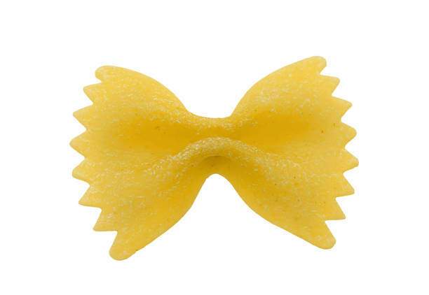 Single bow tie pasta. Clipping path. Isolated on white background. Single bow tie pasta. Isolated on white background. Clipping path carbohydrate food type photos stock pictures, royalty-free photos & images