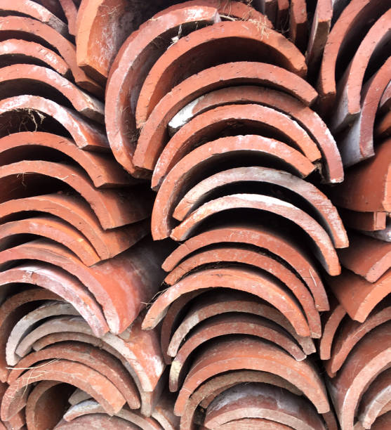 istock Stack of old clay roof tiles background 936834144