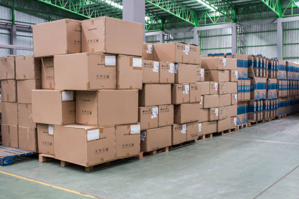 istock warehouse. Rows of shelves with boxes 936834516