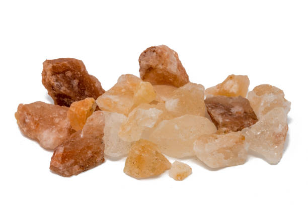 istock Salt stones of various colours stacked against a white background 936836674