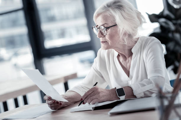 istock Concentrated woman sitting in semi position 936837992