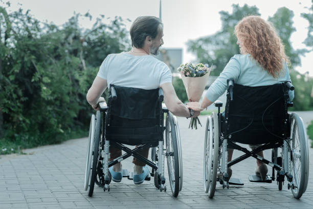 istock Back view of happy couple that walking in park 936841968