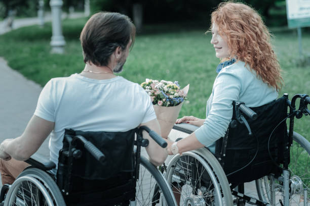istock Happy female person walking with her husband 936841976