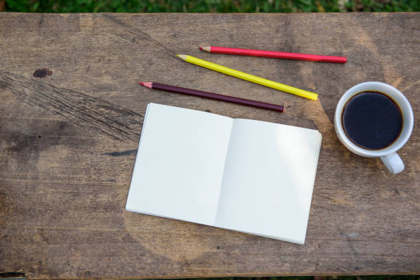 istock Coffee, pencils, notebooks are placed on the table this morning 936845702