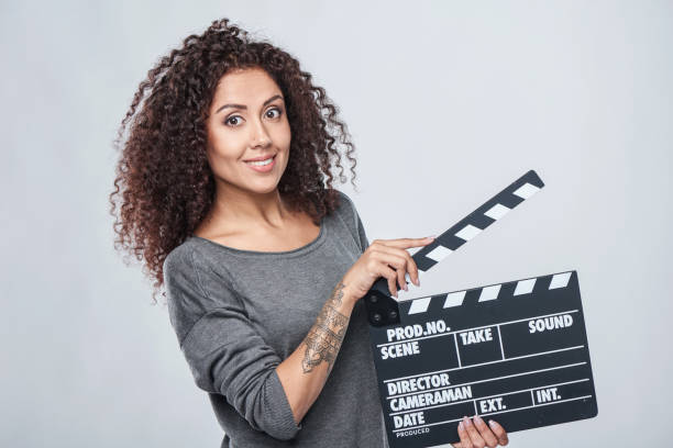 istock Female holding movie clapper board 936849440