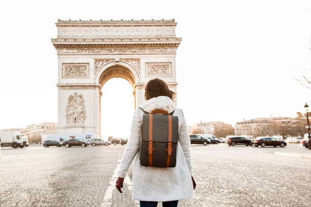 istock Woman walking in Paris, Arc de Triomphe 936849480