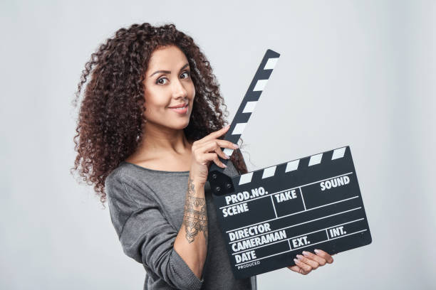 istock Female holding movie clapper board 936849506