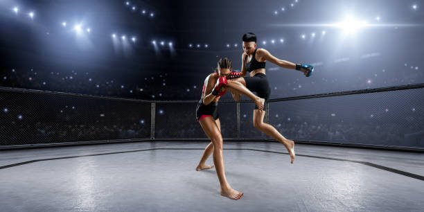 istock Female MMA fighters in professional boxing ring 936850028