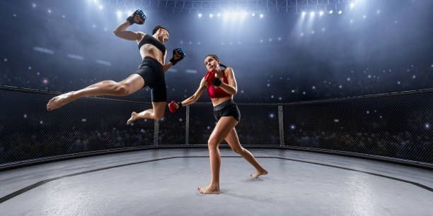 istock Female MMA fighters in professional boxing ring 936850042