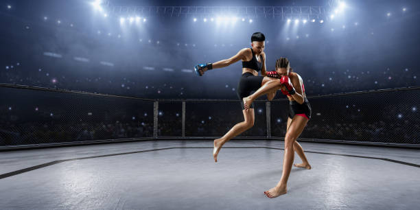 istock Female MMA fighters in professional boxing ring 936850086