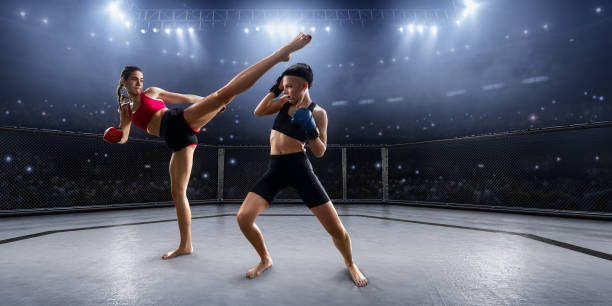 istock Female MMA fighters in professional boxing ring 936850098