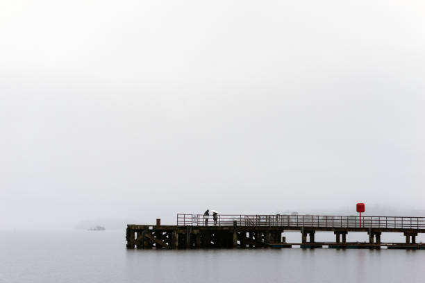 istock Luss Pier in the Mist, Loch Lomond, Scotland 936850242