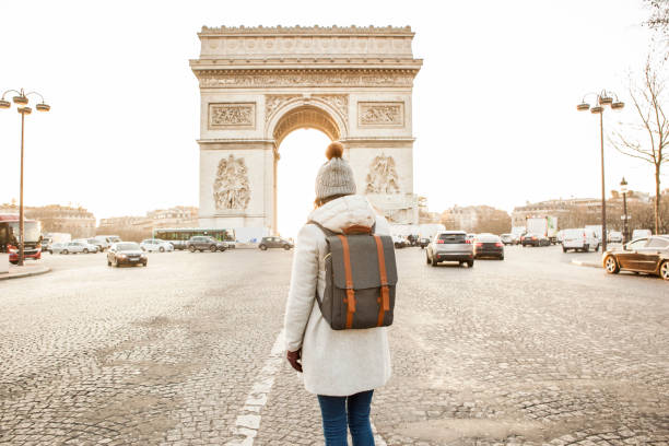 istock Woman walking in Paris, Arc de Triomphe 936851186