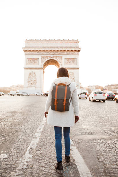 istock Woman walking in Paris, Arc de Triomphe 936851398