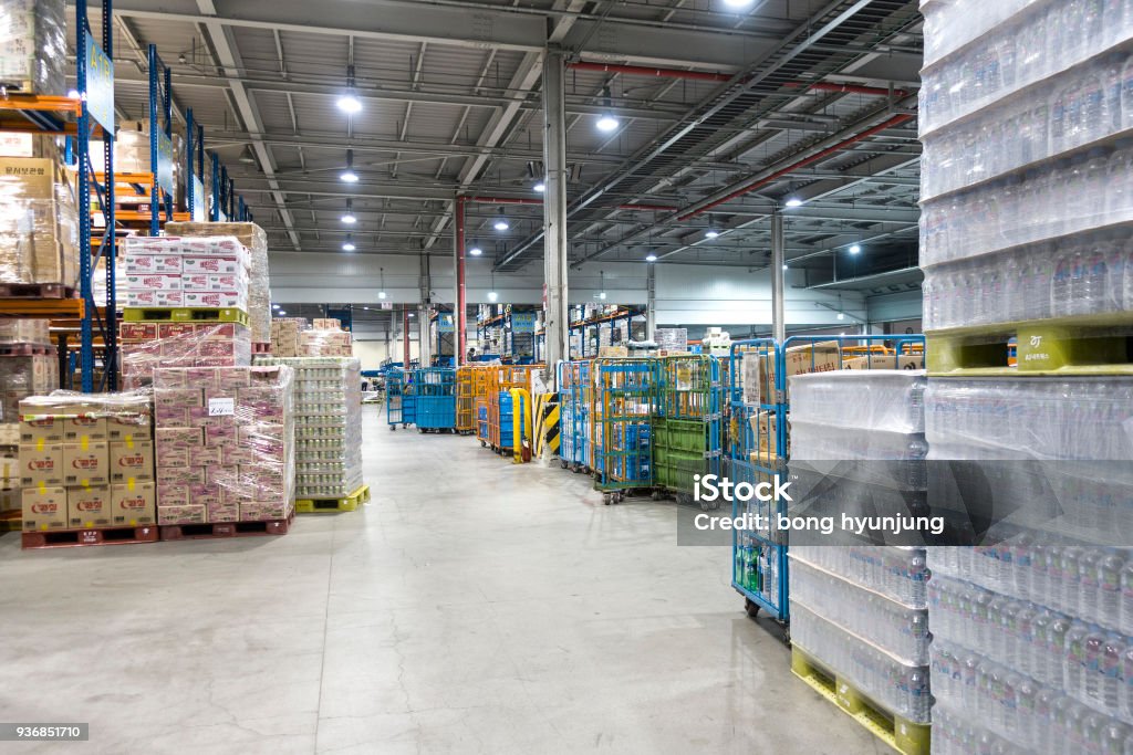 Large modern warehouse with forklifts Warehouse Stock Photo
