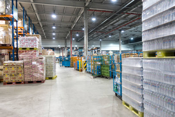Large modern warehouse with forklifts Large modern warehouse with forklifts crate photos stock pictures, royalty-free photos & images