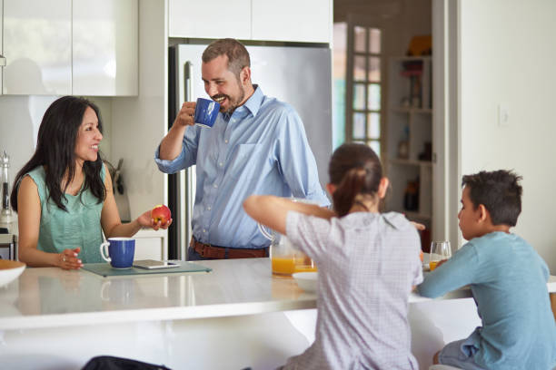 istock Australian family having breakfast at kitchen island 936854026
