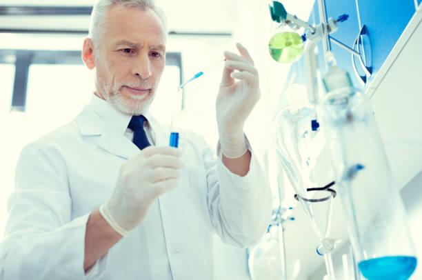 istock Cheerful lab worker working on chemical researcher 936857982