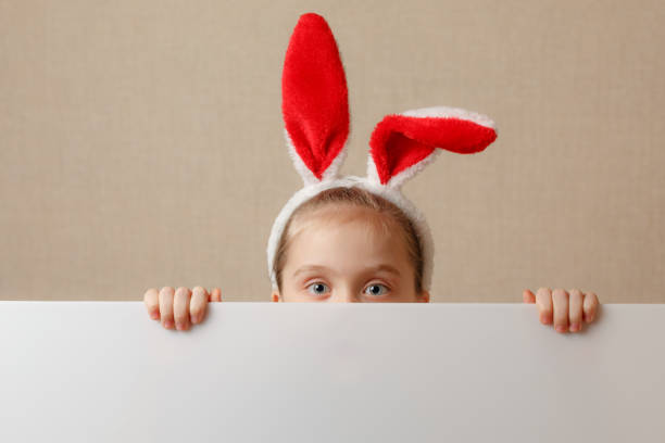 istock Bunny little girl with blank banner. Place for text or theme. 936858066