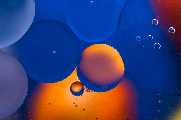 istock Oil drops on water surface abstract background 936858328