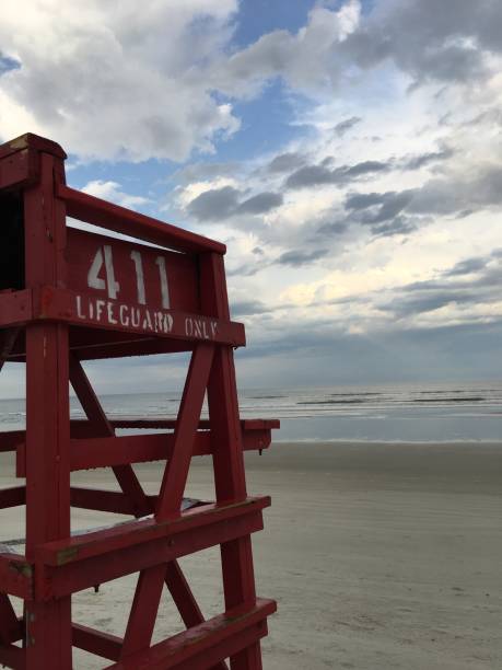 istock Red lifeguard stand at low tide at New Smyrna Beach 936859270