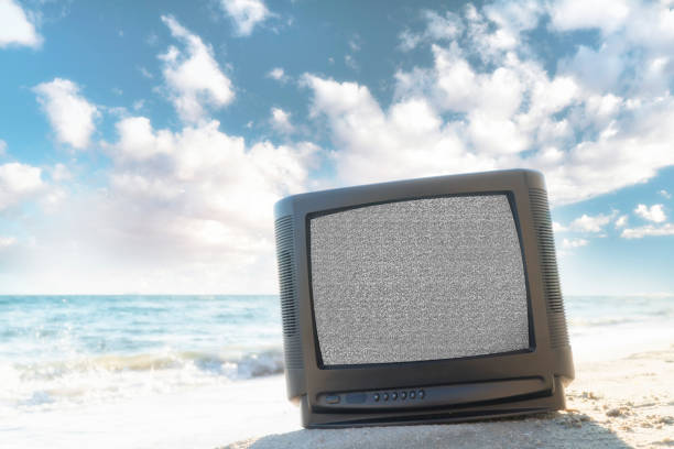 istock Old retro tv on the beach from front view 936862100