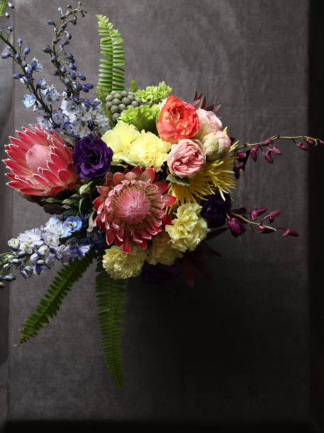 istock Still life with flowers in black 936873298