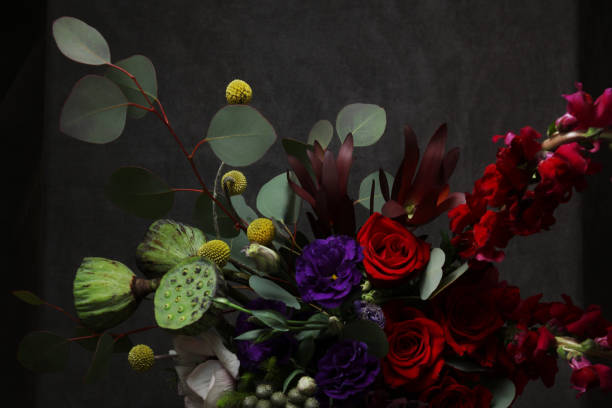 istock Still life with flowers in black 936873320