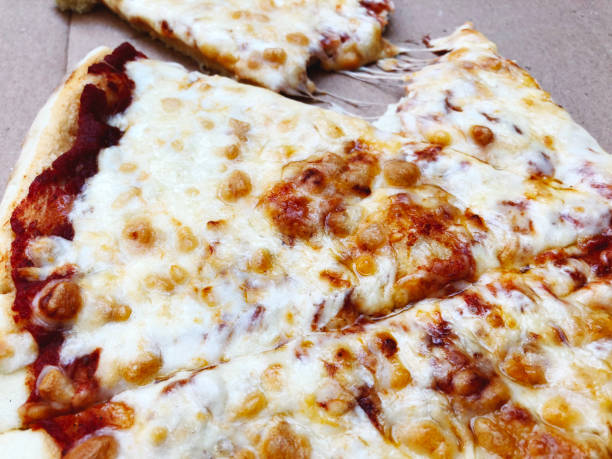 istock Delivery box with delicious pizza. Pizza to order. Pizza in a cardboard box 936873398