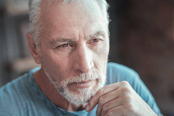 istock Concentrated serious man looking aside and thinking 936877118