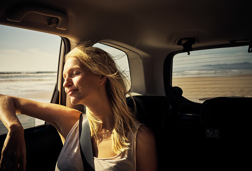 Shot of an attractive young woman going on a road trip