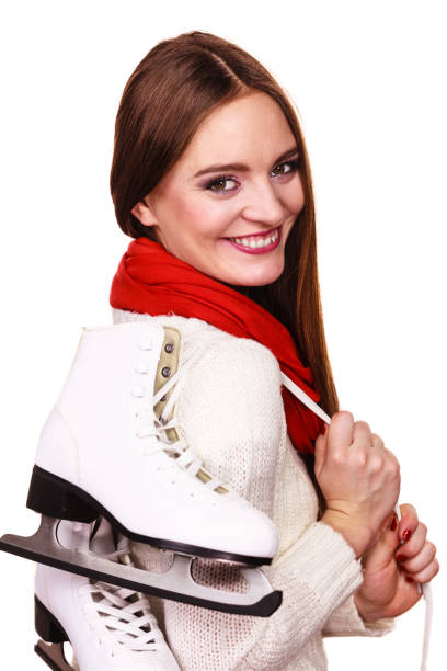 istock Smiling woman with ice skates 936883374