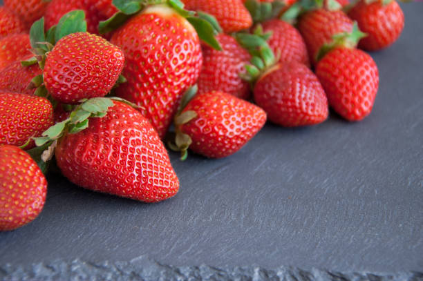 istock Fresh strawberries on a gray background with copy space 936883474