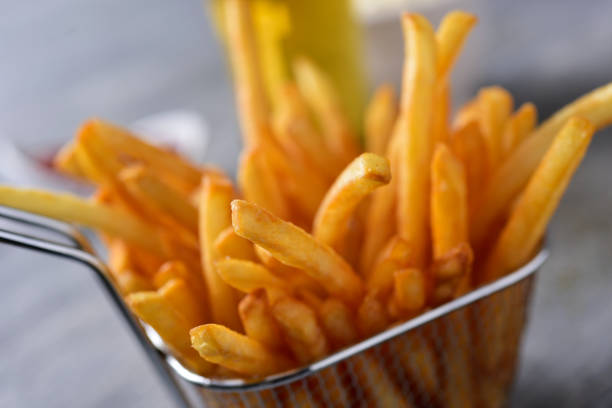 istock french fries in a metal basket 936886268