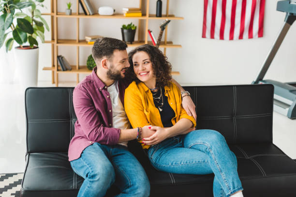 istock Smiling man and woman holding each other by hands 936886290