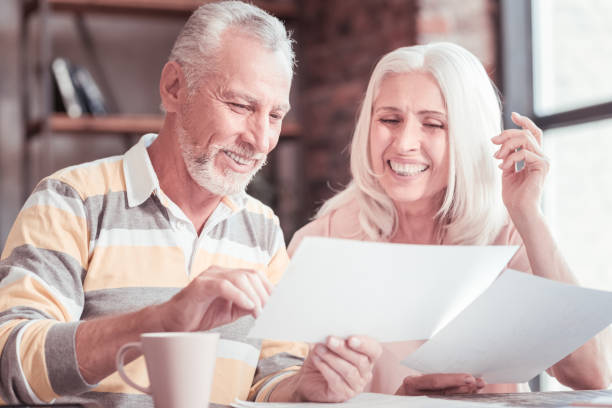 istock Pleasant cute couple sitting and working with documents 936886844