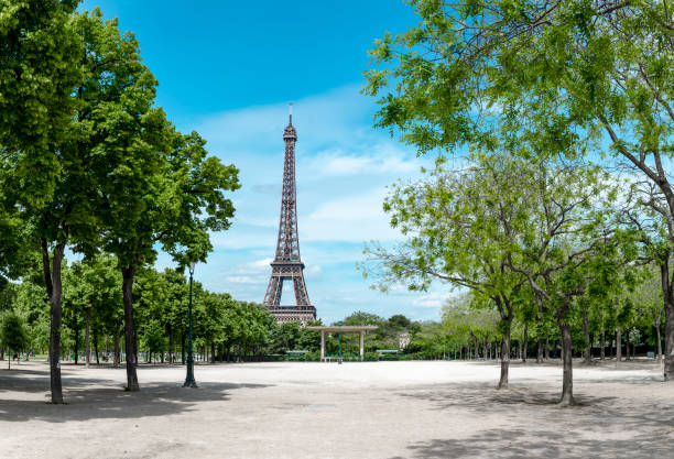 istock Paris, Eiffel tower behind spring trees, panorama from the Champ de Mars 936890074