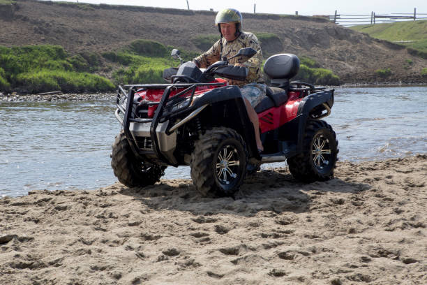 istock Tourists on all-terrain vehicles. On ATV 936894802