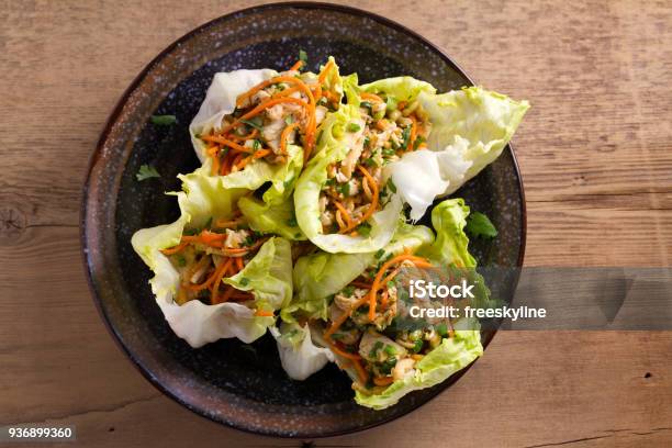 Lettuce Wraps With Chicken Carrot Peanuts And Scallion Stuffed Iceberg Lettuce Leaves With Chicken Stock Photo - Download Image Now