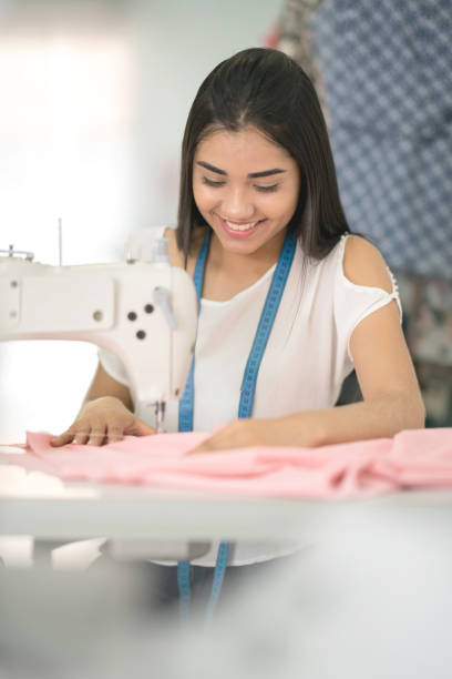 istock Happy seamstress sewing at an atelier 936901508