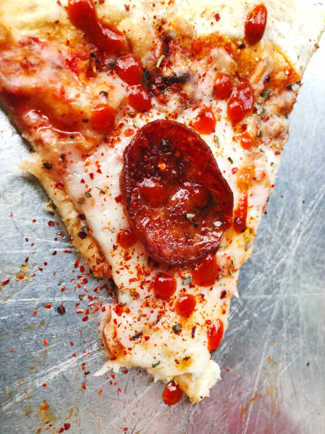 istock Delivery delicious pizza. Pizza to order. Pizza on an iron tray 936902432