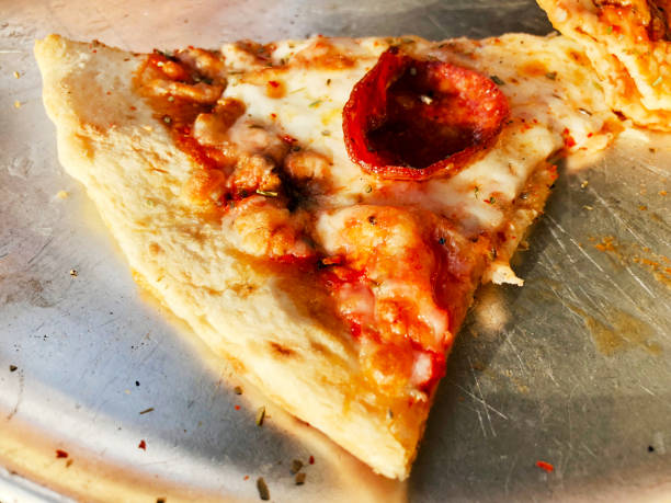 istock Delivery delicious pizza. Pizza to order. Pizza on an iron tray 936902492