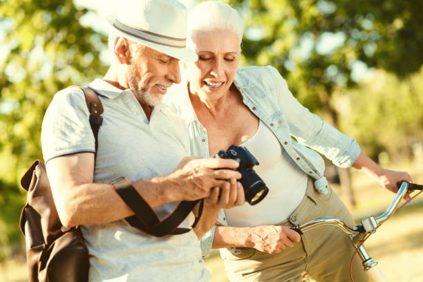 istock Nice elderly woman looking at the photos 936908024